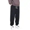 Calça casual masculina primavera calça de moletom plus size solta versátil extra grande tornozelo amarrado Esportiva calça masculina primavera e outono