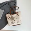 Bolsa de Praia para Férias na Beira-Mar Feminina 2025 Nova de Verão Bolsa de Ombro Trançada Grande Capacidade Bolsa Tote de Palha de Axila