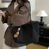 Bolso de mujer vintage de gran capacidad 2026 nueva moda bolso tote de gamuza con un toque de alta gama para el trabajo y los desplazamientos bolso de hombro