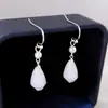 Pendientes antiguos retro de alta gama con orquídea y magnolia. Pendientes Hanfu de estilo chino con cara de caballo para mujer. Diseño elegante.