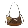 Nova bolsa de mão outono/inverno com estampa de leopardo e tema de gato, um design de luxo moderno e único com um laço, uma bolsa de tamanho mini adequada para mães e filhas, e pode ser carregada sob o braço ou usada como bolsa transversal.