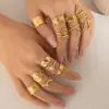 Anillo de apertura geométrica popular europeo y americano de acero de titanio personalidad femenina hip hop línea cruz pequeña serpiente anillo de acero inoxidable venta al por mayor