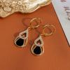 Pendientes de circonita con forma de gota de agua negra, estilo dulce y fresco, elegantes, ligeros y de lujo, con hebilla de oreja de estilo frío y exquisito.