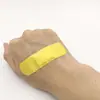 Fábrica de Origen Color Caramelo Dibujos Animados Impermeable Tiritas Color Sólido Tiritas Hemostasia de Heridas Anti-Abrasión Pie OK Elástico
