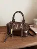 Bolso de mano vintage de alta costura tipo bolsa de almohada para mujer, nuevo bolso de hombro de moda otoño e invierno 2025, bolso cruzado versátil para el día a día