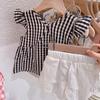 Traje nuevo 2024 traje de tirantes para niñas traje de dos piezas verde verano viaje viaje ropa de verano ropa para niños