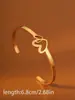Pulseira em aço inoxidável em formato de coração transfronteiriça, pulseira de cruz banhada a ouro 18k à prova d'água, acessório de borboleta de alta qualidade europeu e americano para mulheres