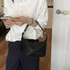 Bolsa de Palha Tecida de Nicho Feminina 2026 Novo Estilo Coreano Bolsa Meia-Lua Bolsa para Trabalho e Deslocamento Versátil Bolsa de Ombro Único Transversal