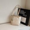 Bolso de Mano Pequeño con Bloques de Color en Relieve de Moda Transfronterizo para Mujer 2026 Nuevo Bolso de Hombro Versátil para el Trabajo Bolso Cubo de Primavera