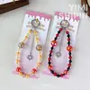 Correa de cadena para teléfono con cuentas de cristal, colgante de estrella colorida del cielo estrellado, cadena para colgar el teléfono, accesorio popular para bolso, pequeño regalo