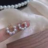 Pendientes de flores huecas de doble capa, pendientes de diseño de camelia vintage francesa, pendientes nuevos de temperamento de perla al por mayor