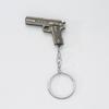 Pendente de carro de mini pistola de metal criativo modelo de simulação chaveiro de pistola para enviar aos amigos enfeites de presente comemorativo
