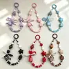 Cadena para teléfono con cara sonriente de dopamina en forma de corazón, pulsera de cuentas con lazo, cadena de muñeca Xiaohongshu, amuleto para bolso, cámara y botella de agua