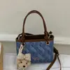 Bolso pequeño súper popular para mujer, nuevo y moderno bolso de cubo de verano para el trabajo, de hombro y cruzado
