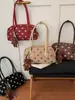 Bolso de hombro de lunares de alta gama transfronterizo, de nicho, con un diseño color-block fresco, dulce y elegante, perfecto como bolso de mano casual, moderno y chic.