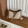 Bolso de mano de diseño nicho de alta gama transfronterizo para mujer, nueva colección otoño 2026, bolso de hombro versátil de estilo coreano retro simple