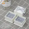 Caja de joyería con lazo blanco, bolso de mano, envío directo de una pieza, paño para pulir plata, certificado, caja de embalaje para collar, juego de cajas de regalo