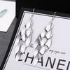 Brincos europeus e americanos transfronteiriços formam uma variedade de moda metal exagerado borla temperamento longo elementos populares brincos eardrop