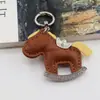Bestseller transfronteiriço: Chaveiro "Fique Rico Logo" cravejado de diamantes, pingente de bolsa cavalo de balanço em PU, cavalo pequeno criativo estilo ins, atacado de fábrica
