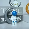 Plástico Luna Sentada Astronauta Creativo Modelo Pequeño de Astronauta Muñeca Piloto Espacial Dibujos Animados Adornos de Escritorio