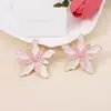 Versión coreana de los nuevos pendientes exagerados de aleación con forma de gota de aceite y doble flor, únicos, con costuras de doble color, pendientes de temperamento elegante