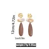Nuevo producto transfronterizo: Pendientes geométricos exagerados europeos y americanos para mujer, aretes colgantes ovalados de imitación de madera color café de moda vintage y broqueles al por mayor
