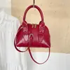 Bolsa de ombro e transversal feminina estilo coreano transfronteiriça, bolsa de mão fashion, novo modelo de verão 2026, bolsa tipo concha simples para o dia a dia do trabalho