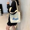Bolso de lona de verano estilo coreano, nuevo, de gran capacidad, para compras, para ir al trabajo, con cordón y letras sencillas.