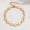 Novo modelo de comércio exterior, sensação de luxo leve e alta qualidade, pulseira de concha de abalone, pulseira de aço inoxidável com concha branca iridescente, requintada e versátil, atacado