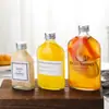 Botella de vidrio para bebidas al por mayor 250 ml botella de vino de frutas botella de jugo botella de té de leche botella de enzimas botella de vino pequeña se puede imprimir logotipo