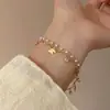 Colar de pérolas borboleta de camada dupla estilo desejo puro feminino 2024 novo colar acessórios leve nicho de luxo empilhado cadeia de clavícula