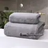 Toalha de lã de coral transfronteiriça toalha de banho cor sólida grossa absorvente adulto toalha de banho grande pode ser adicionada toalha publicitária conjunto de toalha de banho