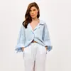 Moda transfronteriza europea y americana para mujer, otoño e invierno 2026, camisa de color liso con cuello, de un solo pecho, mangas acampanadas, corbata y abertura