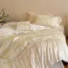 Estilo romántico francés femenino Tencel de algodón ultra suave con volantes y encaje color crema juego de ropa de cama casual de cuatro piezas