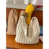 Bolsa tejida de gran capacidad transfronteriza para mujer, nuevo bolso de hombro versátil casual calado 2026, bolsa de playa estilo vacación costera