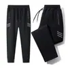 Pantalones de chándal para hombre Primavera y Otoño Nuevos Bolsillo con Cremallera Pantalones Antirrobo Delgados Rectos Sueltos Versátiles Joggers