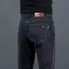 Pantalones vaqueros gruesos con forro polar de invierno para hombre, pantalones holgados y rectos, pantalones casuales elásticos negros de alta gama para primavera y otoño para hombre.