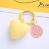 Nuevo Llavero de Corazón Escarchado para Coche Lindo Dibujo Animado Sonriente Amor Colgante de Metal para Llavero de Pareja