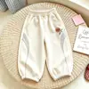 Pantalones deportivos infantiles de estilo europeo y americano, versión coreana, diseño color block, pantalones deportivos casuales para primavera y otoño, con puños elásticos
