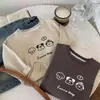 Camiseta para Niños 2026 Primavera Nueva Holgada Linda Cachorro Capa Base Niños y Niñas Top Sencillo Moderno Versátil Estampada