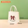 En stock: Bolsa de lona con diseño de Santa Claus para Navidad, bolsa de regalo, recuerdo de fiesta navideña, bolso de mano festivo