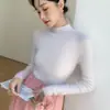Otoño e Invierno nuevo sin costuras primera línea Ropa suéter de cachemira para mujer ajustado de cuello alto medio suéter ajustado de punto camisa básica