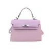 Otoño 2026 Nuevo Bolso Kelly Bolso de Mano Fresco de Gama Alta Bolso Cruzado para Mujer Sentido de Gama Alta Bolso de Diseño de Nicho bolsos