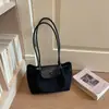 Bolso pequeño vintage de textura de alta calidad para mujer 2026 nuevo estilo moderno versátil de un solo hombro para llevar debajo del brazo bolso de mano para ir al trabajo