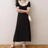 Vestido negro francés con cuello de loto y estampado floral dulce, novedad de verano 2024, vestido ligero de lujo de longitud media con mangas cortas y corte de té.
