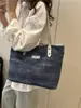 Bolsa Jeans para Mulheres 2025 Nova Tendência Moda Nicho Simples Ombro Transversal Versátil Bolsa Tote Exportação