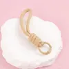 Llavero cordón de cuerda trenzada de nailon para hombres y mujeres hebilla de montañismo cuerda de mano para parejas colgante de bolsa teléfono llave lazo