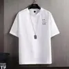 Verano 2026 Nuevo Estilo Camiseta de Manga Corta Holgada Talla Grande para Jóvenes Estilo Japonés de Media Manga Marca de Moda Ropa para Hombre