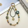 Novo Estilo Ins Cordão Curto para Celular com Contas de Cristal Pintura a Óleo Estrela Pingente Criativo de Liga Metálica Floco de Neve Acessório para Celular