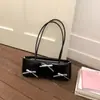 Bolsa Prata para Mulheres 2025 Nova Tendência Moda Bolsa de Ombro com Laço Grande Capacidade Versátil para o Dia a Dia Bolsa de Axila